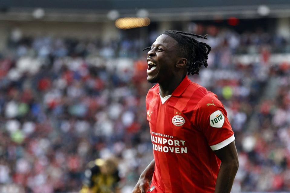 PSV's Johan Bakayoko celebrates after scoring his fourth goal during the Dutch Eredivisie football match between PSV Eindhoven and Vitesse Arnhem at the Phillips stadium, in Eindhoven, on April 13, 2024. (Photo by MAURICE VAN STEEN/ANP/AFP via Getty Images)