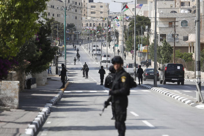 <p>Palestinian security forces line up the street during the visit of the U.S. President Donald Trump in the West Bank city of Bethlehem, Tuesday, May 23, 2017. President Trump has arrived in Bethlehem for a meeting with Palestinian President Mahmoud Abbas.(AP Photo: Nasser Shiyoukhi/AP) </p>