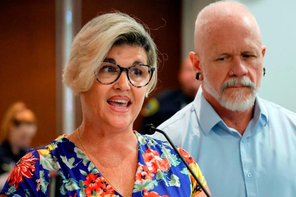 Jessica Norton, with her husband, Gary, speaks during the public comment period at a Broward County School Board meeting in Fort Lauderdale held on Tuesday, June 18, 2024. Norton, whose daughter played on the Monarch High School volleyball team, was one of five Monarch officials removed from the school Nov. 27 amid an inquiry into possible violations of the “Fairness in Women’s Sports Act,” a 2021 law that bans transgender girls from playing on girls’ sports teams. Norton is the only one facing potential discipline. (Amy Beth Bennett / Sun Sentinel)