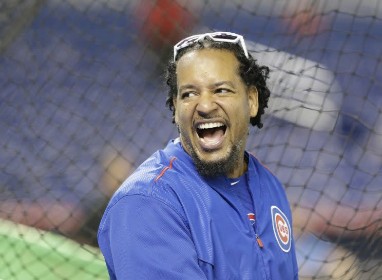 Chicago Cubs hitting consultant Manny Ramirez laughs as he watches practice before a baseball game between the Miami Marlins and the Chicago Cubs, Monday, June 1, 2015, in Miami. (AP Photo/Wilfredo Lee)