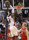 Miami Heat forward LeBron James (6) dunks the ball against Houston Rockets forward Chase Budinger (10) during the second half of an NBA basketball game, Sunday, April 22, 2012, in Miami. (AP Photo/Wilfredo Lee)