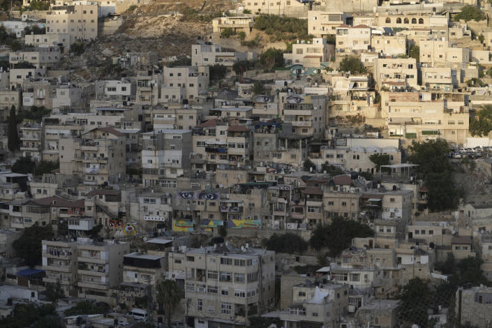 Murals that are part of the public art project 'I Witness Silwan' depicting the eyes of local and international figures are painted on houses in the Silwan neighbourhood of east Jerusalem, Friday, Aug. 26, 2022. Eyes are always open in this flashpoint district. Now, new eyes emerged; they were painted on the walls of the decaying Palestinian homes. The eye murals, and graffiti of Palestinian symbols, are so giant that make you feel they are watching you wherever you walk in the neighborhood. (AP Photo/ Mahmoud Illean)