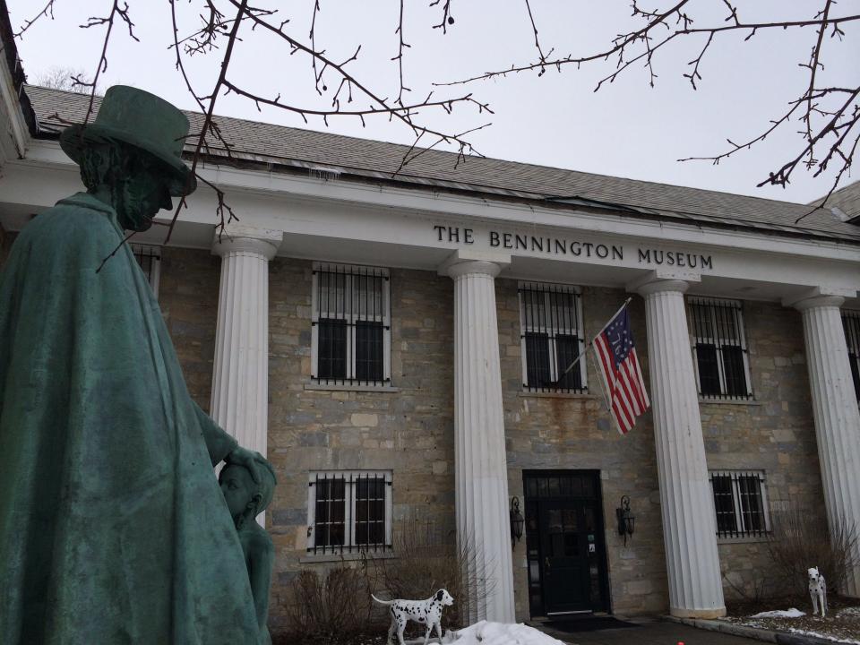 A statue of Abraham Lincoln stands outside the Bennington Museum.