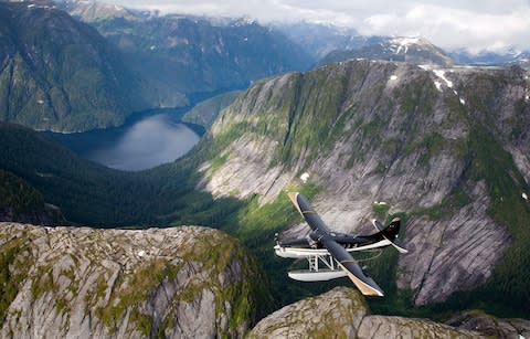 Plane flying over Misty Fjords national monument - Credit: Getty