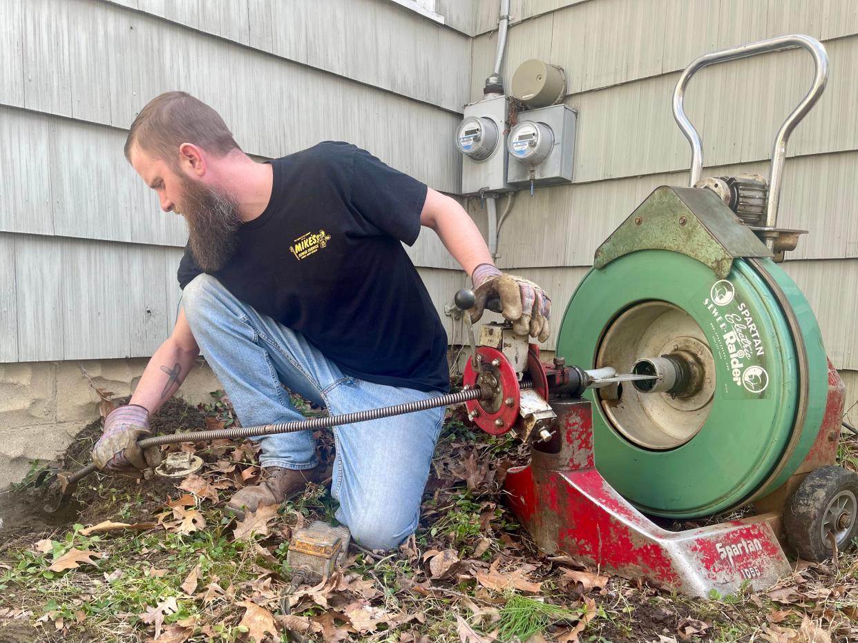 Jason Schultz, owner of Mike's Sewer Service in Monroe, performs annual maintenance on an outside clean out for tree root removal.