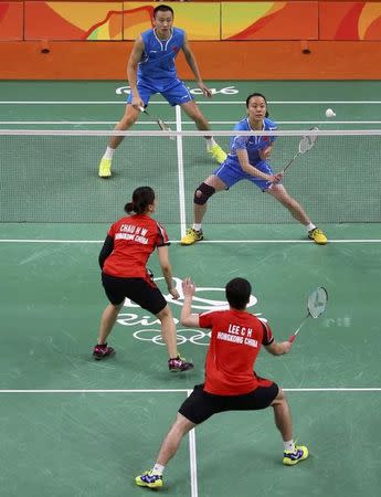 2016 Rio Olympics - Badminton - Mixed Doubles Group Play - Riocentro - Pavilion 4 - Rio de Janeiro, Brazil - 12/08/2016. Zhang Nan (CHN) of China and Zhao Yunlei (CHN) of China play against Lee Chun Hei (HKG) of Hong Kong and Chau Hoi Wah (HKG) of Hong Kong. REUTERS/Marcelo del Pozo