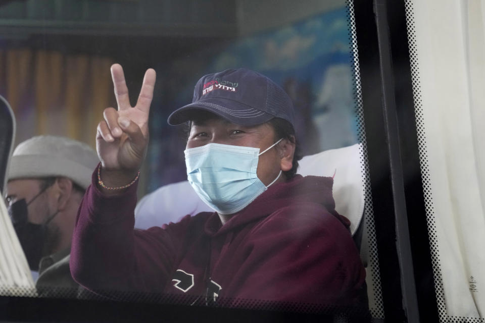 Thai overseas workers who were evacuated from Israel, leave after arriving at Suvarnabhumi International Airport, in Samut Prakarn Province, Thailand, Thursday, Oct. 12, 2023. The first Thai nationals evacuated since the latest war between Israel and Hamas returned home Thursday. (AP Photo/Sakchai Lalit)