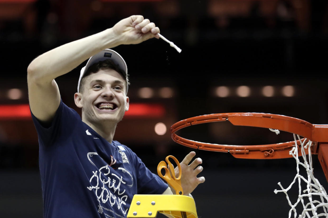 Virginia's Kyle Guy celebrates after Virginia defeated Purdue, 80-75, in overtime of the men's NCAA Tournament college basketball South Regional final game, Saturday, March 30, 2019, in Louisville, Ky. (AP Photo/Michael Conroy)