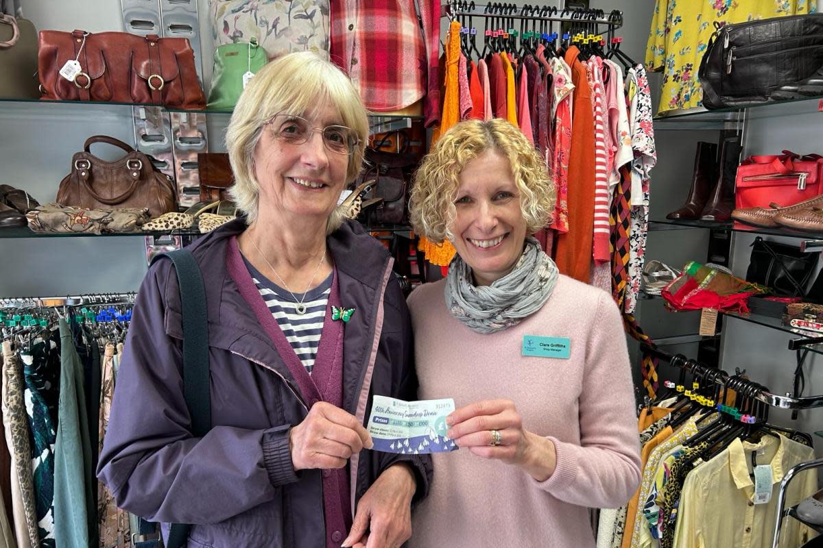 The raffle winner, Rita Bullock (left) and St Richard's Hospice Upton shop manager Clare Griffiths (left) pictured with the winning ticket <i>(Image: St Richard's Hospice)</i>