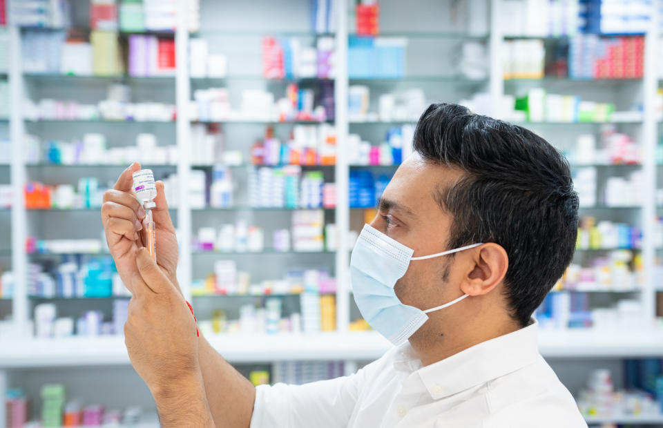 A pharmacist draws up a dose of the Oxford University-AstraZeneca vaccine in London. Photo: PA