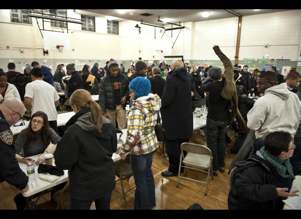 The New York City Department of Homeless Services assisted by volunteers prepares to leave to put on a homeless count in the borough of Manhattan's Murray Hill neighborhood Jan. 30, 2012. (Damon Dahlen, AOL)