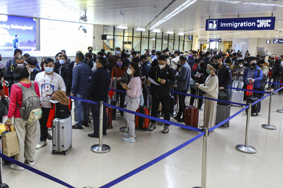 Chinese tourists from Xiamen, China arrive at the Ninoy Aquino International Airport in Manila on Tuesday, Jan. 24, 2023. The expected resumption of group tours from China is likely to bring far more visitors. (AP Photo/Gerard V. Carreon)