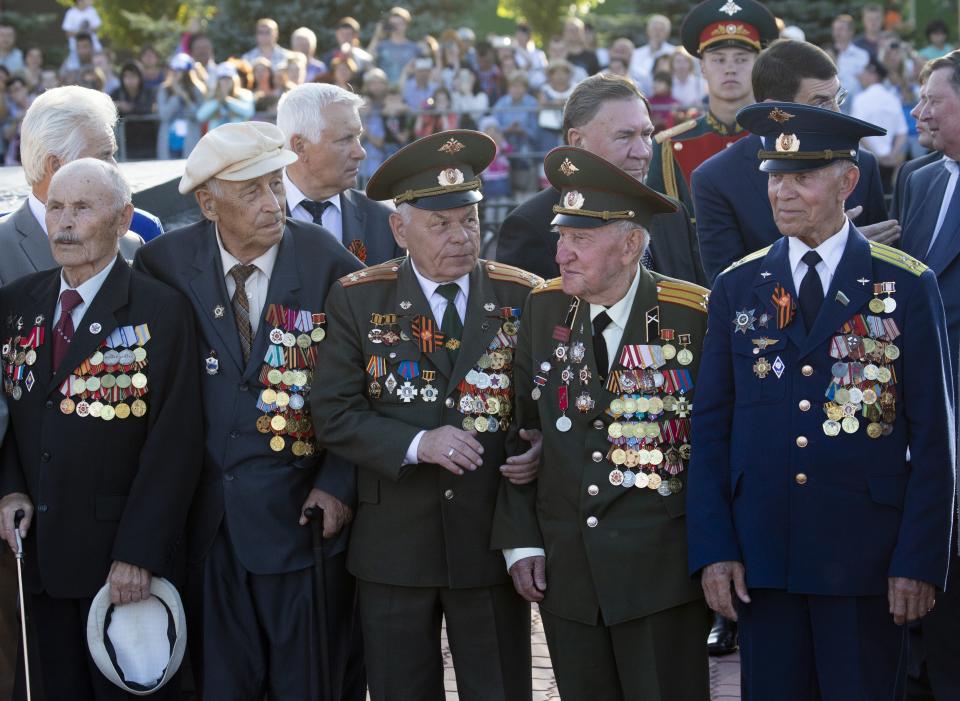 WWII veterans wait to Russian President Vladimir Putin to attend a laying ceremony in Kursk, 426 kilometers (266 miles) south of Moscow, Russia, Thursday, Aug. 23, 2018. Putin attends a ceremony marking the 75th anniversary of the battle of Kursk in which the Soviet army routed Nazi troops. It is described by historians as the largest tank battle in history involving thousands of tanks. (AP Photo/Alexander Zemlianichenko, Pool)