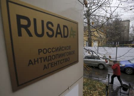 FILE PHOTO: A man walks outside an office of the Russian Anti-Doping Agency (RUSADA) in Moscow, Russia, November 10, 2015. REUTERS/Maxim Shemetov/File Photo