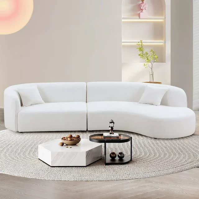 <p><a href="https://go.redirectingat.com?id=74968X1596630&url=https%3A%2F%2Fwww.walmart.com%2Fip%2FWILLIAMSPACE-126-Luxury-Modern-Style-Curved-Sofa-Upholstery-Boucle-Sofa-Couch-2-Pillows-Right-Hand-Facing-Sectional-Fabric-Living-Room%2F2167074606&sref=https%3A%2F%2Fwww.housebeautiful.com%2Fshopping%2Ffurniture%2Fg39761253%2Fbest-curved-sofa-picks%2F" rel="nofollow noopener" target="_blank" data-ylk="slk:Shop Now;elm:context_link;itc:0;sec:content-canvas" class="link rapid-noclick-resp">Shop Now</a></p><p>Luxury Modern Curved Sofa</p><p>walmart.com</p><p>$2499.00</p>