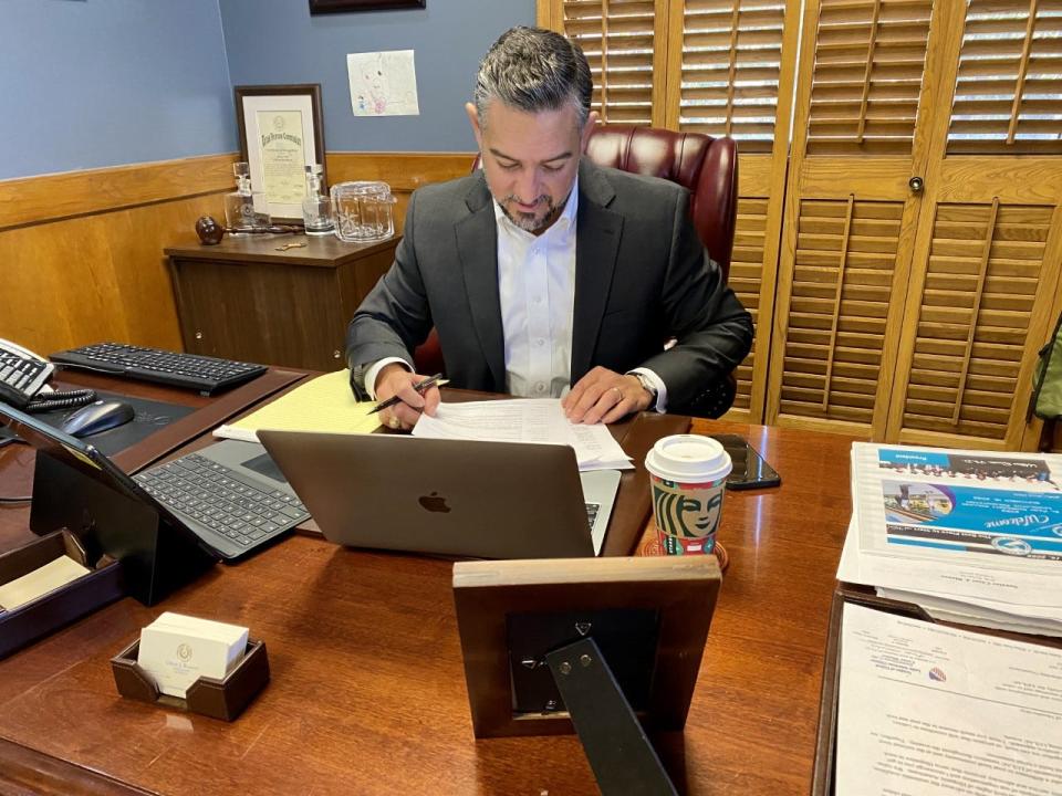 State Sen. César Blanco, D-El Paso, reviews a stack of documents in his El Paso office on Dec. 13. Blanco was preparing for the session of the Texas Legislature.