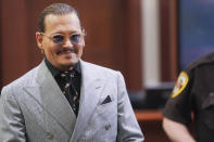 Actor Johhny Depp returns from a break at the Fairfax County Circuit Courthouse in Fairfax, Va., Thursday, May 19, 2022. Actor Johnny Depp sued his ex-wife Amber Heard for libel in Fairfax County Circuit Court after she wrote an op-ed piece in The Washington Post in 2018 referring to herself as a "public figure representing domestic abuse." (Shawn Thew/Pool Photo via AP)