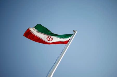 FILE PHOTO: FILE PHOTO: An Iranian national flag flutters in Tehran April 15, 2011.   REUTERS/STR/File PhotoREUTERS