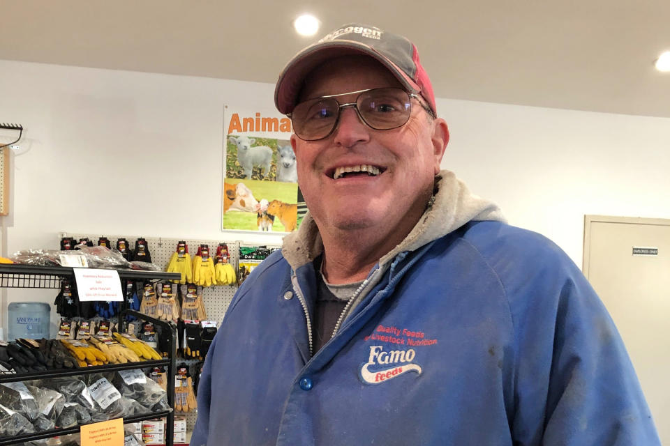 In this Nov. 21, 2019 photo, Minnesota farmer Jeff Ampe talks about impeachment and Minnesota's 7th District congressional race after dropping off a load of corn at the Feed Co. feed mill in Paynesville, Minn. Ampe, a conservative Republican, likes his incumbent Democratic congressman, House Agriculture Committee Chairman Collin Peterson. But he also likes Peterson's leading GOP challenger, former Lt. Gov. Michelle Fischbach, of Paynesville. (AP Photo/Steve Karnowski)