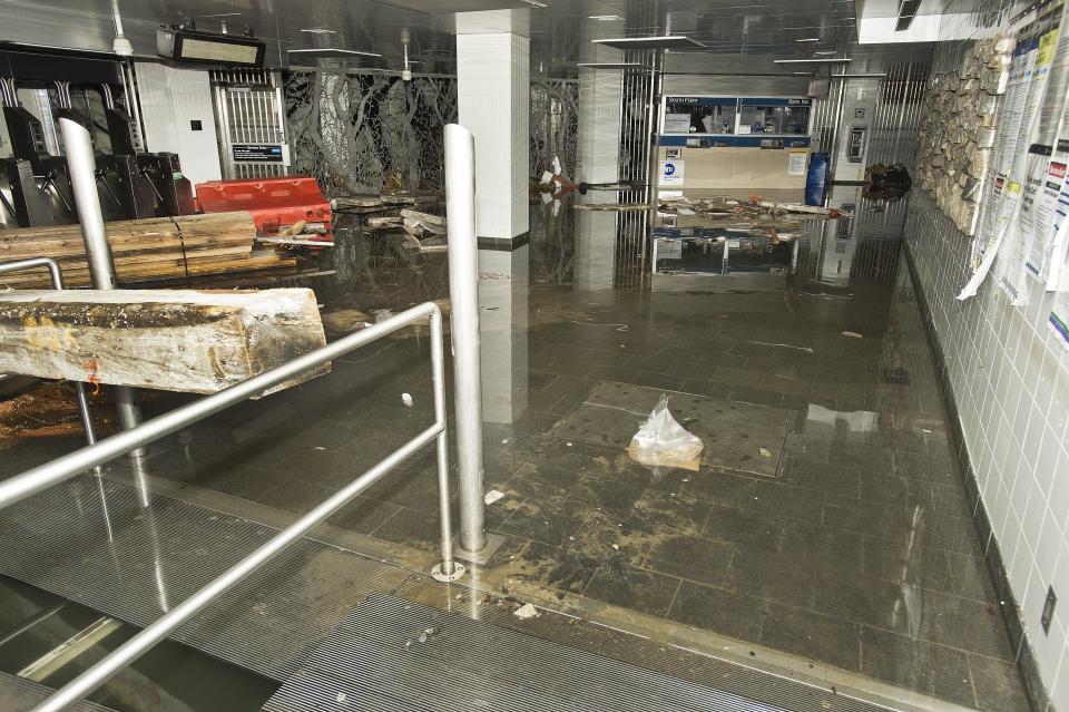 This photo provided by the Metropolitan Transportation Authority shows the South Ferry subway station after it was flooded by seawater during superstorm Sandy on Tuesday, Oct. 30, 2012. Sandy, the storm that made landfall Monday, caused multiple fatalities, halted mass transit and cut power to more than 6 million homes and businesses. (AP Photo/ Metropolitan Transportation Authority)