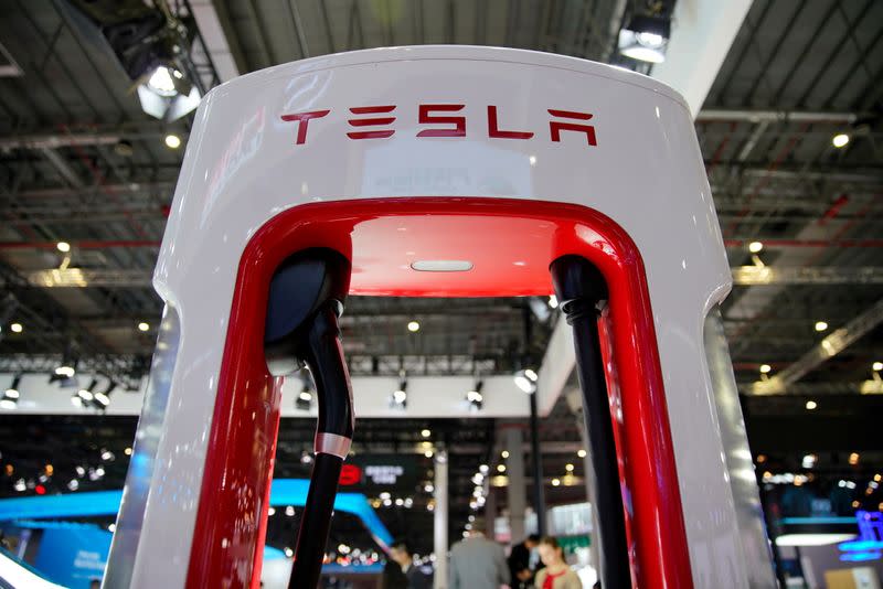 FILE PHOTO: Tesla charging station is pictured during the media day for the Shanghai auto show in Shanghai