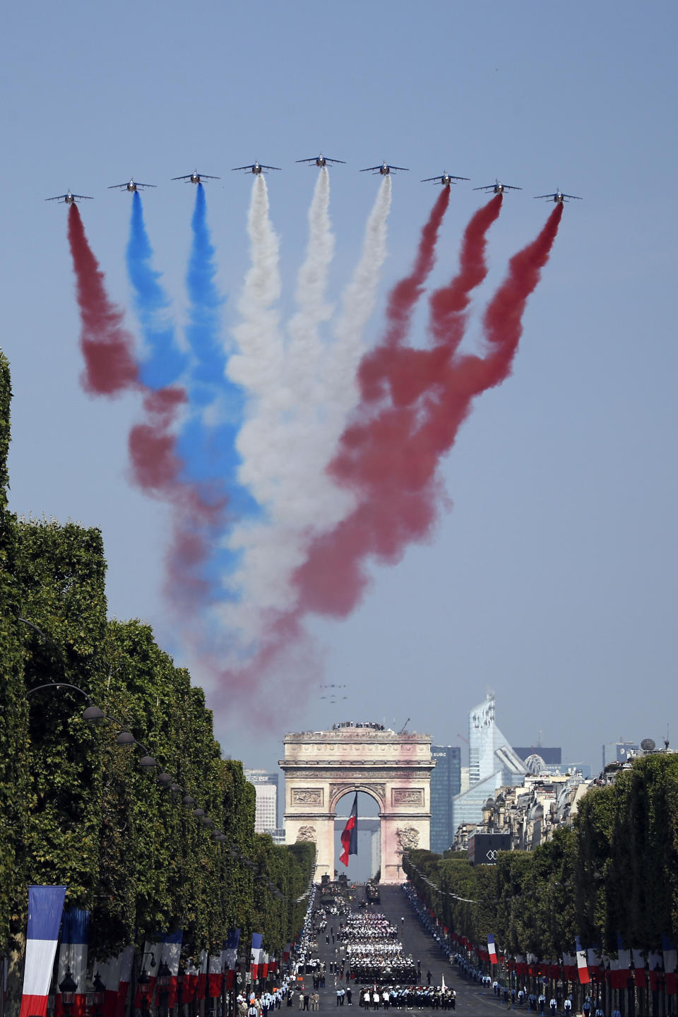 <p>French Alphajets of the Patrouille de France fly over the Champs-Élysées, with the Arc de Triomphe in background, during the Bastille Day parade in Paris, France, Saturday, July 14, 2018. (Photo: Francois Mori/AP) </p>