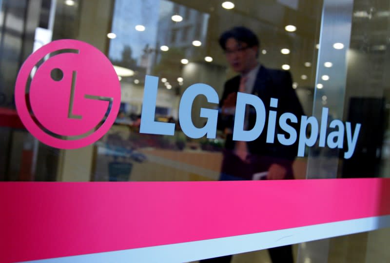 A man walks out of the headquarters of LG Display in Seoul, October 20, 2011. REUTERS/Jo Yong-Hak/File Photo