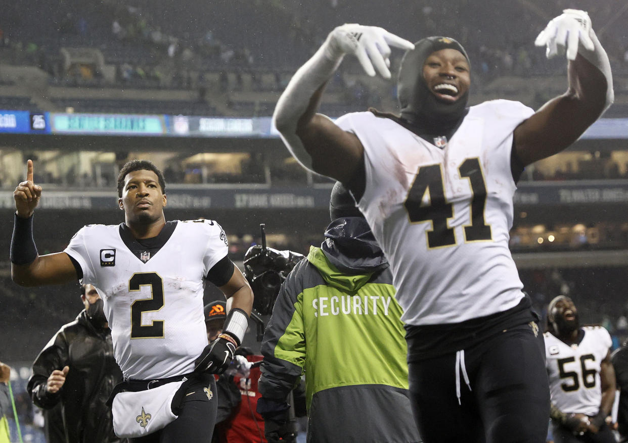 SEATTLE, WASHINGTON - OCTOBER 25: Jameis Winston #2 and Alvin Kamara #41 of the New Orleans Saints react after beating the Seattle Seahawks 13-10 at Lumen Field on October 25, 2021 in Seattle, Washington. (Photo by Steph Chambers/Getty Images)