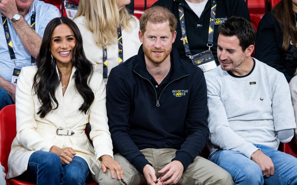 The Duke and Duchess of Sussex watch the volleyball event at the Invictus Games on Sunday - Patrick van Katwijk/Getty Images