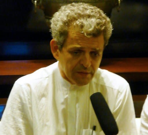 French architect Patrick Devillers speaks to reporters during an interview at Cambodia's Phnom Penh International Airport on July 17. Devillers, 52, is understood to have been a close business associate and friend of Bo and his wife Gu Kailai, key figures in China's biggest political scandal in decades, although his exact role is unclear