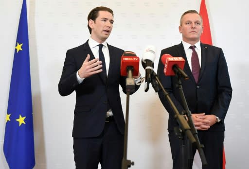 Austrian Chancellor Sebastian Kurz (L) told a press conference that the retired colonel is suspected of working with Russian intelligence from the 1990s until 2018