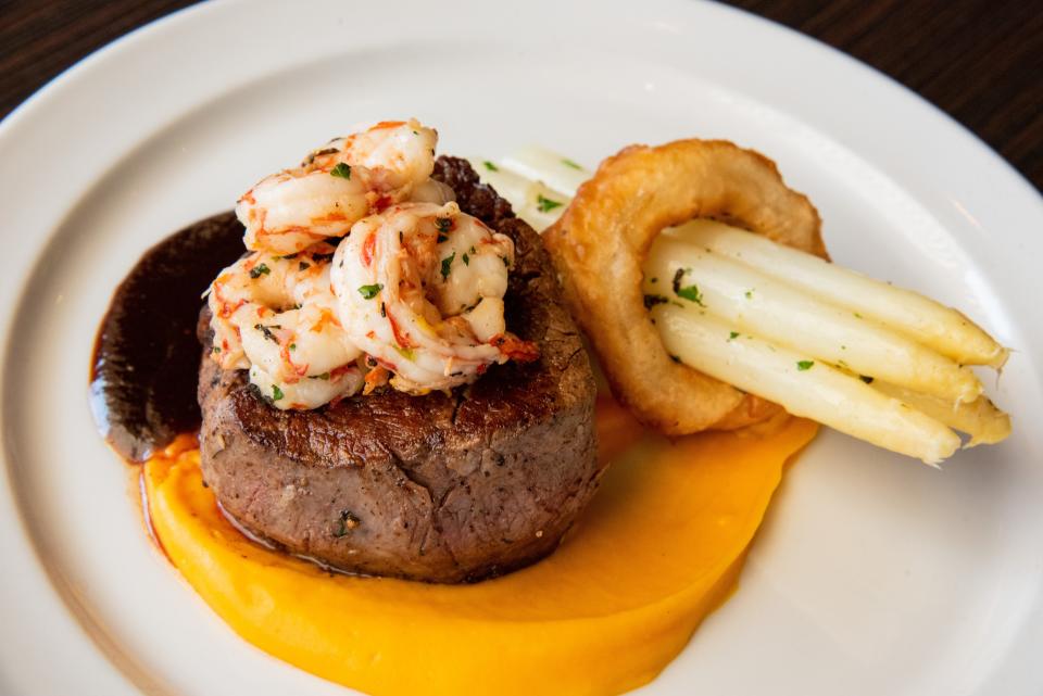 Brasstown 6 oz. filet and red ruby shrimp with carrot emulsion and white asparagus is an Easter special at Isa's French Bistro in Asheville.
