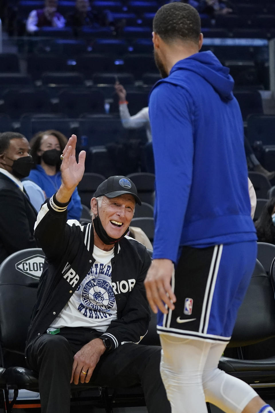 Basketball Hall of Famer Rick Barry, left, congratulates Golden State Warriors guard Stephen Curry after Curry made an underhanded shot in honor of Barry while warming up for the team's NBA basketball game against the Houston Rockets in San Francisco, Friday, Jan. 21, 2022. (AP Photo/Jeff Chiu)