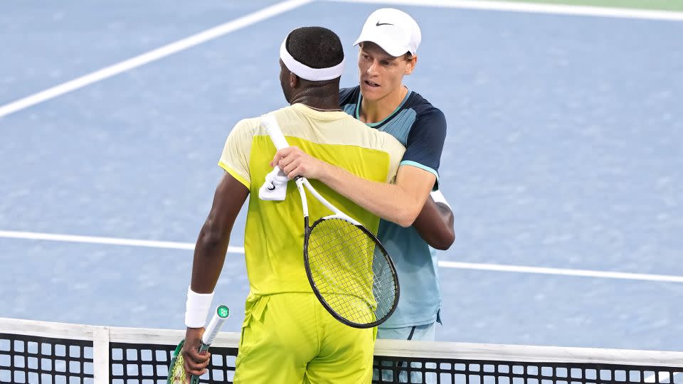 Jannik Sinner hugs Frances Tiafoe after Sinner defeated him 7-6(4), 6-2 to win the men's 2024 Cincinnati Open title. - Dylan Buell/Getty Images