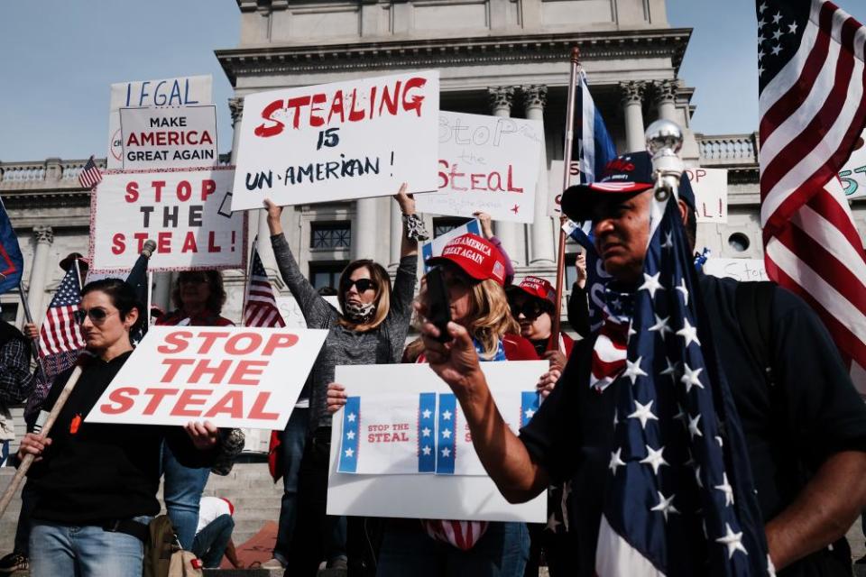 Dozens of people calling for stopping the vote count in Pennsylvania due to alleged fraud against President Donald Trump gather on the steps of the State Capital on November 05, 2020 in Harrisburg, Pennsylvania. The activists, many with flags and signs for Trump, have made allegations that votes are being stolen from the president as the race in Pennsylvania continues to tighten in Joe Biden’s favor.