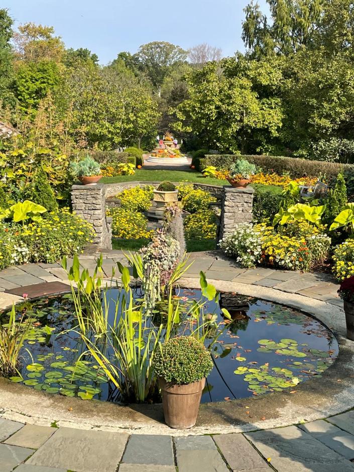 Water features, sculptures, and long vistas lead visitors deep into the gardens.