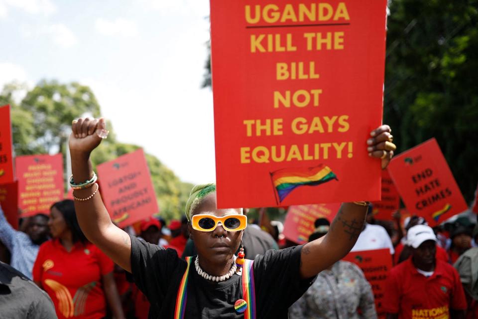 Ugandan queer activist Papa De raises a fist outside the Uganda High Commission during a picket against the country’s anti-homosexuality bill in Pretoria, South Africa, on April 4, 2023. <a href="https://www.gettyimages.co.uk/detail/news-photo/ugandas-queer-activist-papa-de-raises-a-fist-outside-the-news-photo/1250761596?adppopup=true" rel="nofollow noopener" target="_blank" data-ylk="slk:Phill Magakoe/AFP via Getty Images;elm:context_link;itc:0;sec:content-canvas" class="link ">Phill Magakoe/AFP via Getty Images</a>