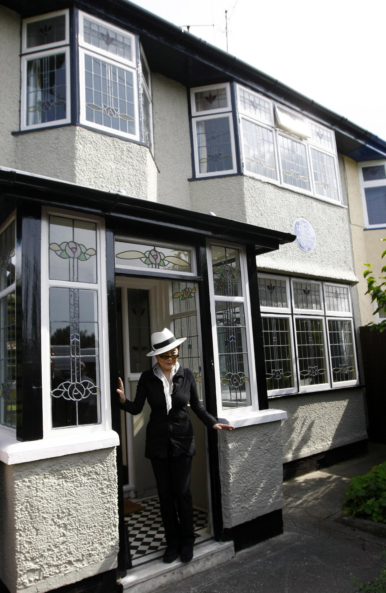 John Lennon's widow Yoko Ono visits his old house in Menlove Avenue, Liverpool, England, Friday, Sept. 3, 2010. (AP Photo/Tim Hales)