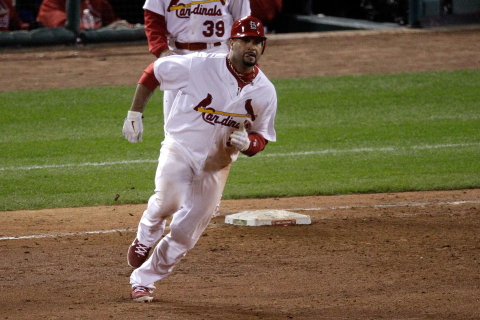 ST LOUIS, MO - OCTOBER 27: Albert Pujols #5 of the St. Louis Cardinals rounds first base after hitting a double in the ninth inning during Game Six of the MLB World Series against the Texas Rangers at Busch Stadium on October 27, 2011 in St Louis, Missouri. (Photo by Rob Carr/Getty Images)