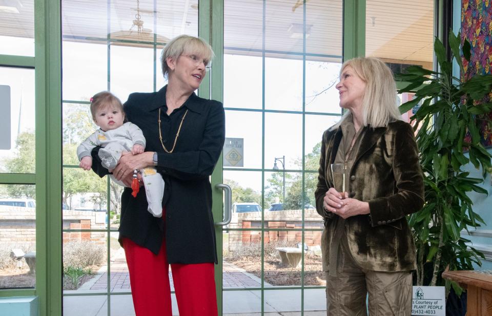 Anne Patterson, a emeritus board member and former assistant district attorney, left, talks about Teri Levin as the Healing Hearts Wing is named in honor of Levin at the Gulf Coast Kid's House. The State Attorney’s Wing at the facility will now be called the Anne M. Patterson, ASA Justice Wing.