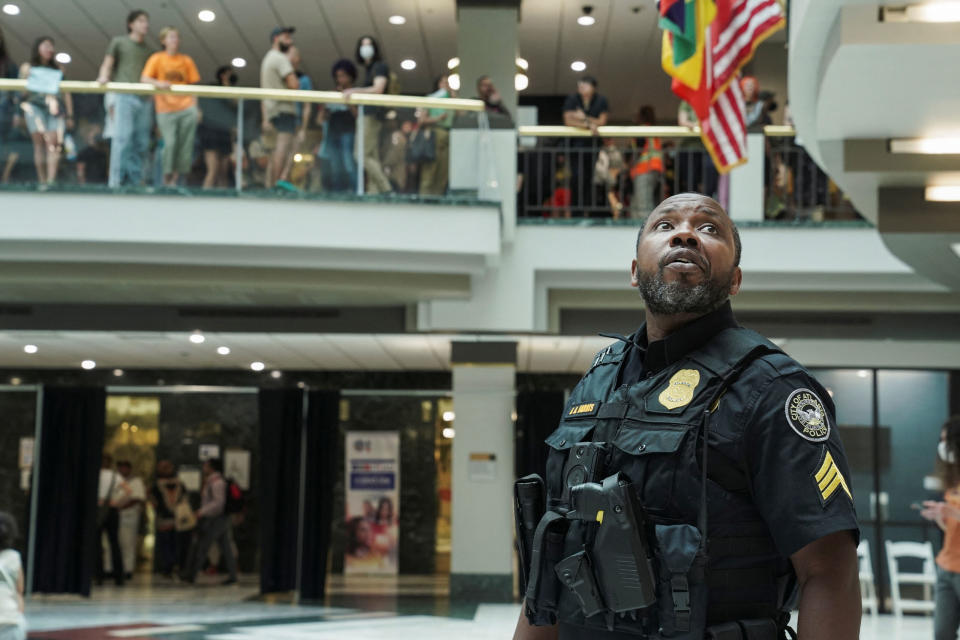 A police officer looks up as people protest against the controversial “Cop City” project, inside the city hall in Atlanta on May 15, 2023.<span class="copyright">Megan Varner—Reuters</span>