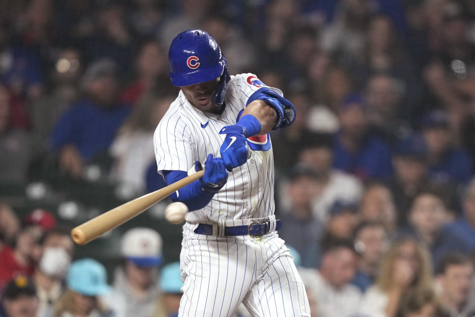 Chicago Cubs' Nico Hoerner hits an RBI single off Philadelphia Phillies relief pitcher Gregory Soto during the eighth inning of a baseball game Tuesday, June 27, 2023, in Chicago. (AP Photo/Charles Rex Arbogast)