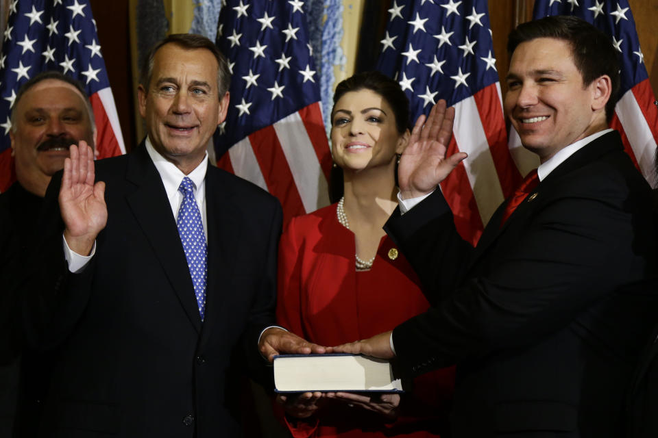 House Speaker John Boehner of Ohio performs a mock swearing in for Rep. Ron DeSantis, R-Fla., Thursday, Jan. 3, 2013, on Capitol Hill in Washington, as the 113th Congress began. (AP Photo/Charles Dharapak) 