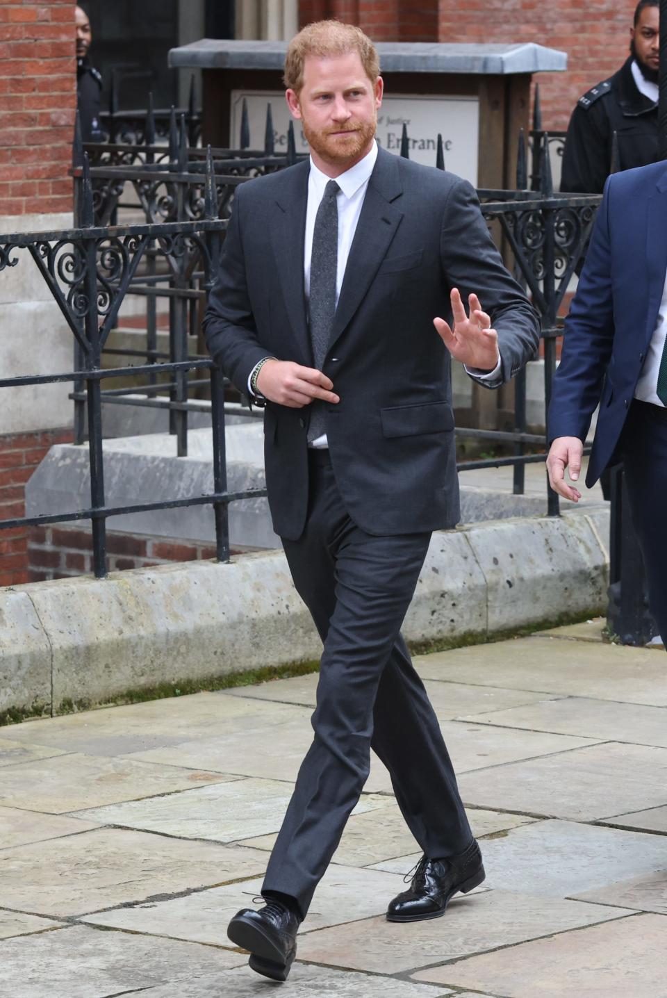 Prince Harry is shown leaving the Royal Courts of Justice in London in March. He is among a variety of claimants in lawsuits against the British press over a phone hacking scandal from years ago.