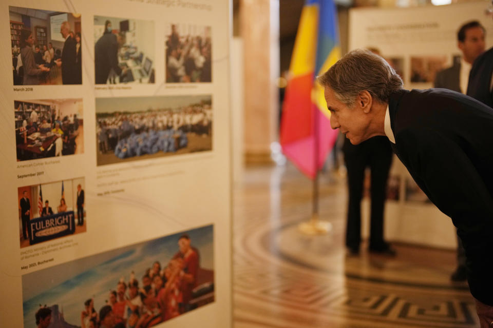 U.S. Secretary of State Antony Blinken visits the photo exhibit at the Romanian Athenaeum in Bucharest, Romania, Tuesday, Nov. 29, 2022. Blinken attends the meeting of NATO Ministers of Foreign Affairs in the Romanian capital. (AP Photo/Vadim Ghirda, Pool)