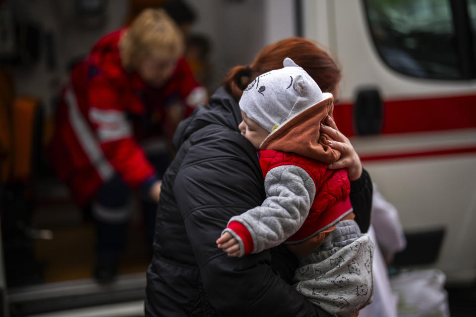 Patients are evacuated from Children's Hospital No. 1 on the outskirts of Kyiv, Ukraine, Friday, April 26, 2024. Doctors and ambulance crews evacuated patients from a Kyiv children's hospital on Friday after a video circulated online saying Russia planned to attack it. (AP Photo/Francisco Seco)