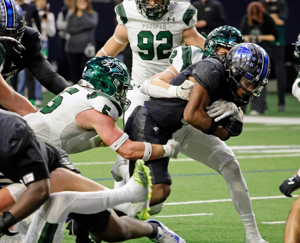 North Crowley running back Ashton Searl (8) bulldogs his way to the end zone in the first half of a UIL Class 6A Division 1 football regional-round playoff game at The Ford Center in Frisco, Texas, Saturday, Oct. 25, 2023.
