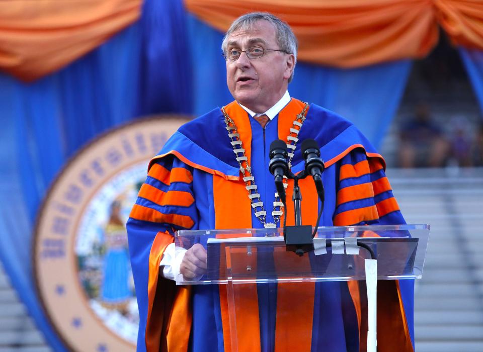 The University of Florida president Kent Fuchs gives a few words to the graduates at the Spring 2022 Commencement Ceremony being held at Ben Hill Griffin Stadium, in Gainesville Fla. April 29, 2022. Florida Gators great Tim Tebow was the commencement speaker. He talked about not just being successful, but being sure that you were being significant.  [Brad McClenny/The Gainesville Sun]   