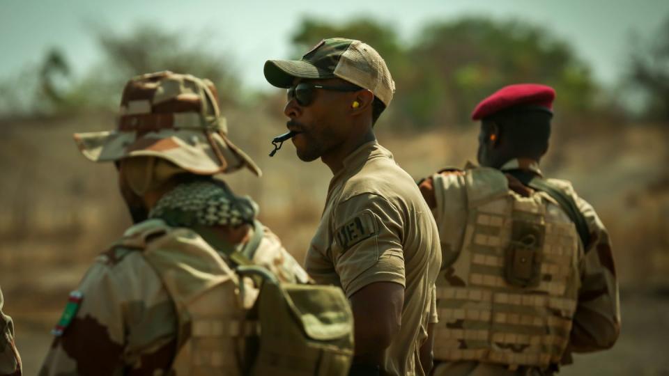 U.S. Army soldier blows a whistle to halt Mauritanian soldiers during dynamic shooting drills at Flintlock in Daboya, Ghana, March 9, 2023. (Spc. Raymon Tibbs/Army)