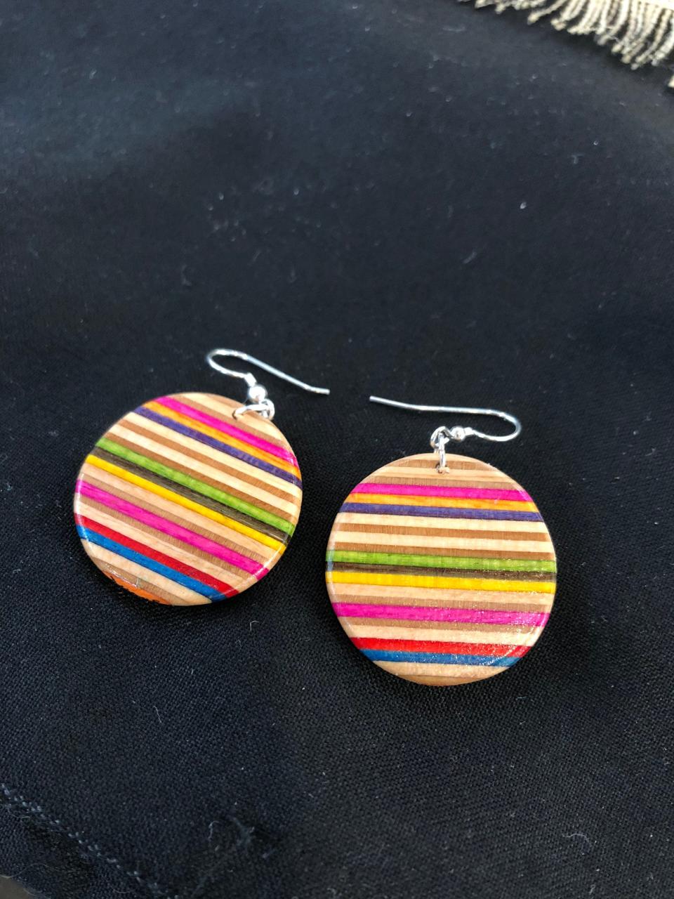 Earrings made from recycled skateboards, by Duque Shop in Providence.